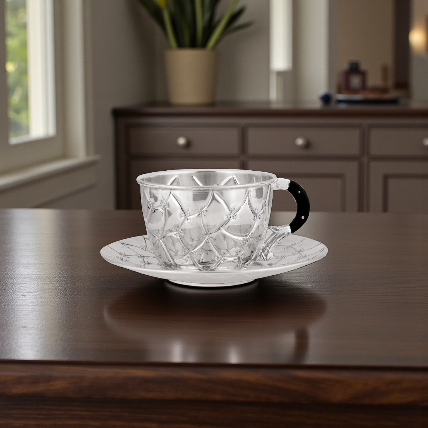 Handcrafted Silver Cup and Saucer with Quilted Floral Engraving