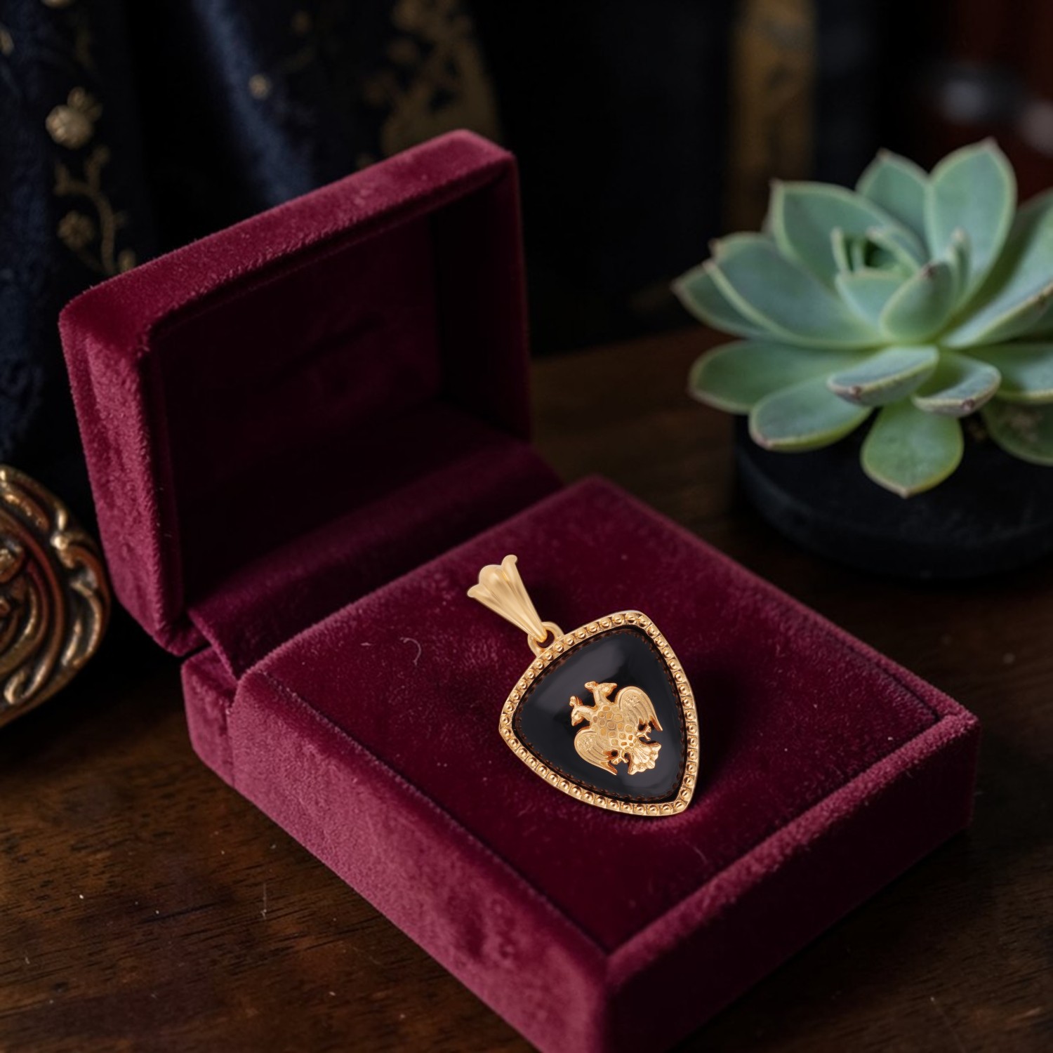 Gold Pendant with Black Onyx and Gandaberunda Motif Triangle Design