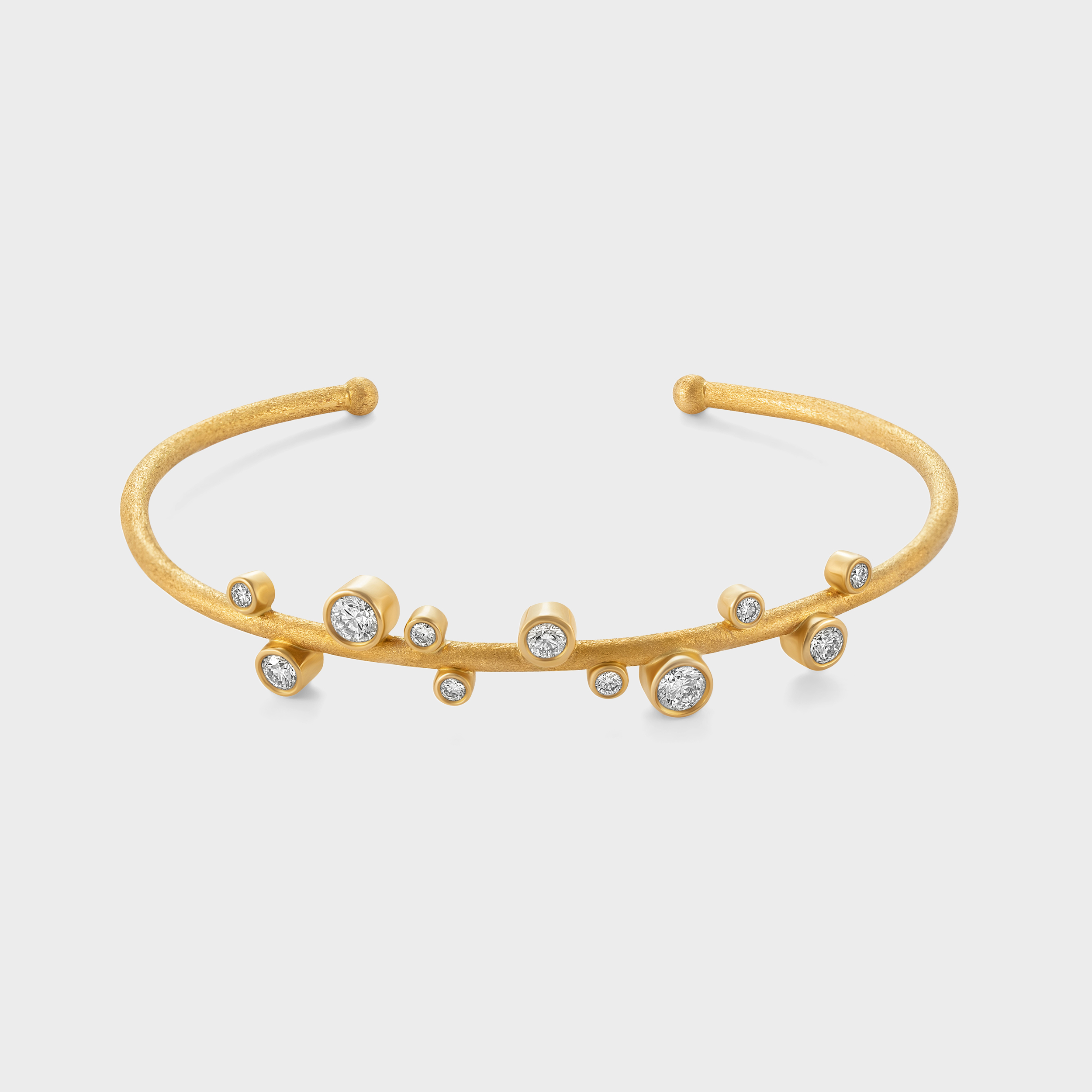 Modern Elegance: Matte Finish Oval-Shaped Bangle with Bezel-Set Diamonds