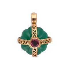 Ornate Gold Cross Pendant with Red Gemstone and Carved Emerald Bead Backdrop